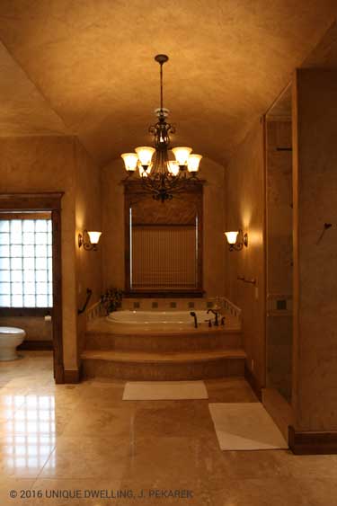 master bathroom bathtub arch ceiling scones chandelier