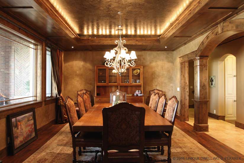 Dining Room with light to accent ceiling, corner lights to accent drapes and a chandelier