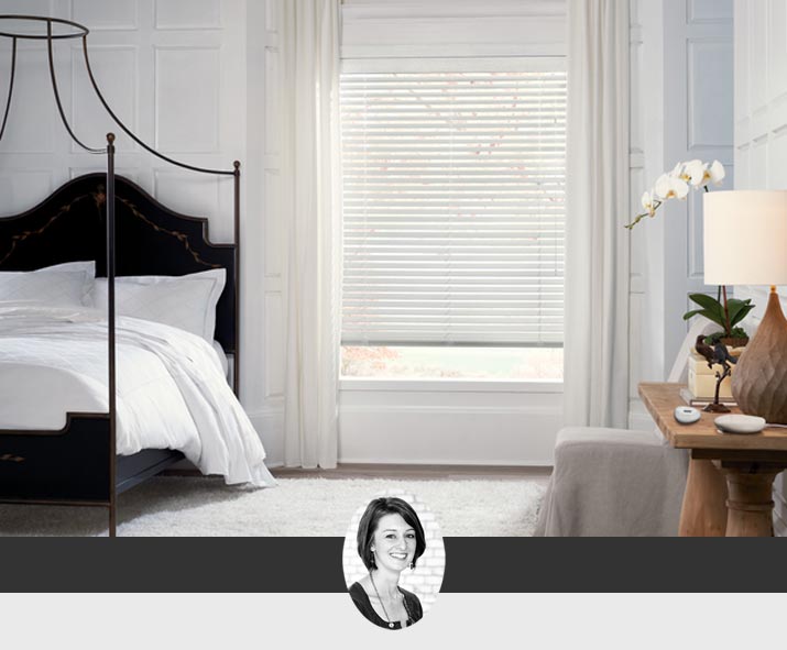 white master bedroom with drapery, canopy bed and white linens