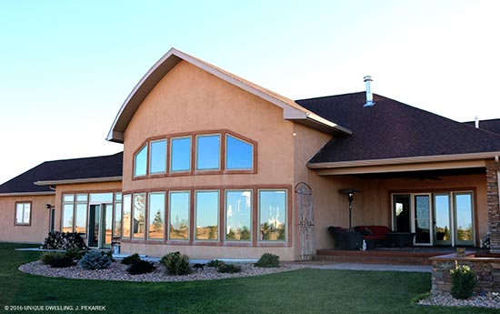 green trimmed window bank on stucco ranch