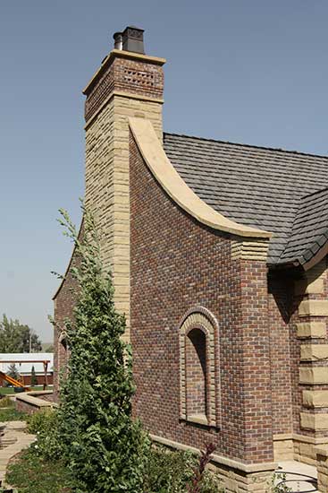 stone and brick fireplace wing walls