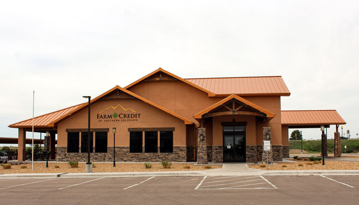 exterior bank stucco stone wood copper roof