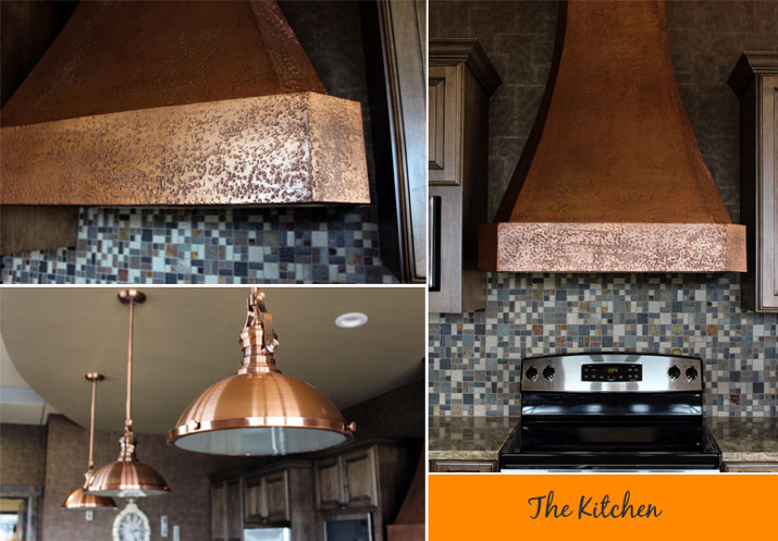 custom copper hood copper and light fixtures fill this Kitchen