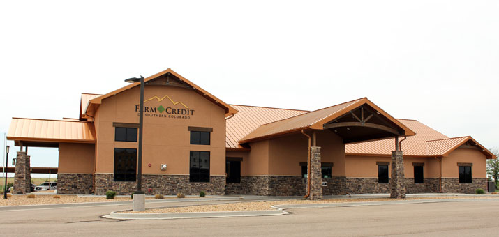 exterior bank stucco stone wood copper roof