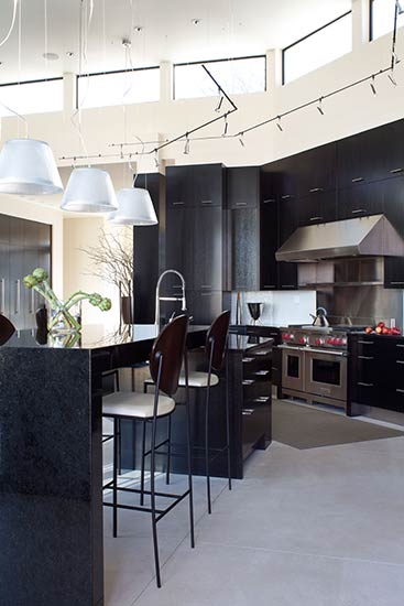 modern kitchen vaulted ceiling clearstory windows black cabinets