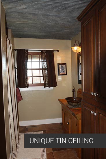 tin ceiling in bathroom creates rustic bathroom