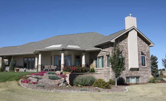 backyard of brick and stucco house