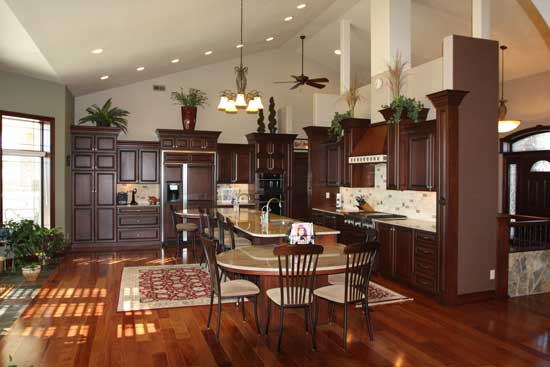 kitchen with cherry cabinets, tan counter tops and wood floor