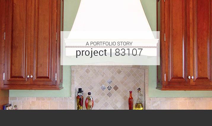 white range hood with cherry cabinets