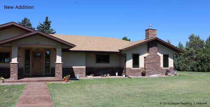 ranch house with double gable front porch with stone and stucco material