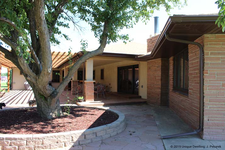 backyard with a tree pergola and porch