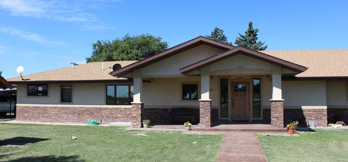 front elevation with stone and stucco